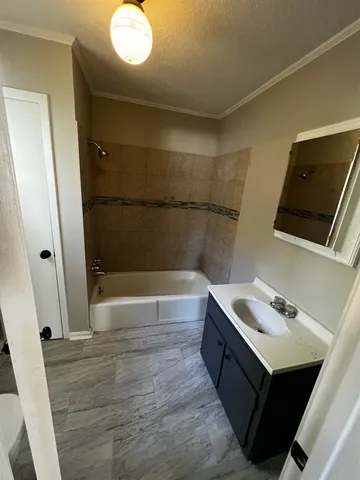 a bathroom with a sink and mirror