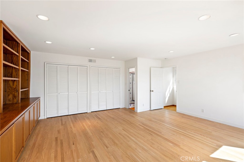 508 Seaview Street Laguna Beach, CA 92651 - Photo 12 of 28 a view of an empty room with wooden floor and a window