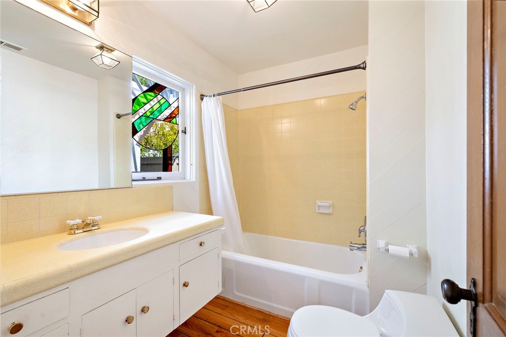 508 Seaview Street Laguna Beach, CA 92651 - Photo 15 of 28 a bathroom with a granite countertop sink and a bathtub