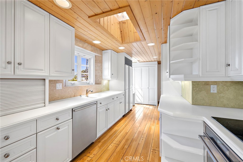 508 Seaview Street Laguna Beach, CA 92651 - Photo 5 of 28 a kitchen with sink and cabinets