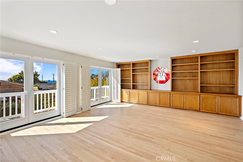 508 Seaview Street Laguna Beach, CA 92651 - Photo 9 of 28 a view of an empty room with wooden floor and windows