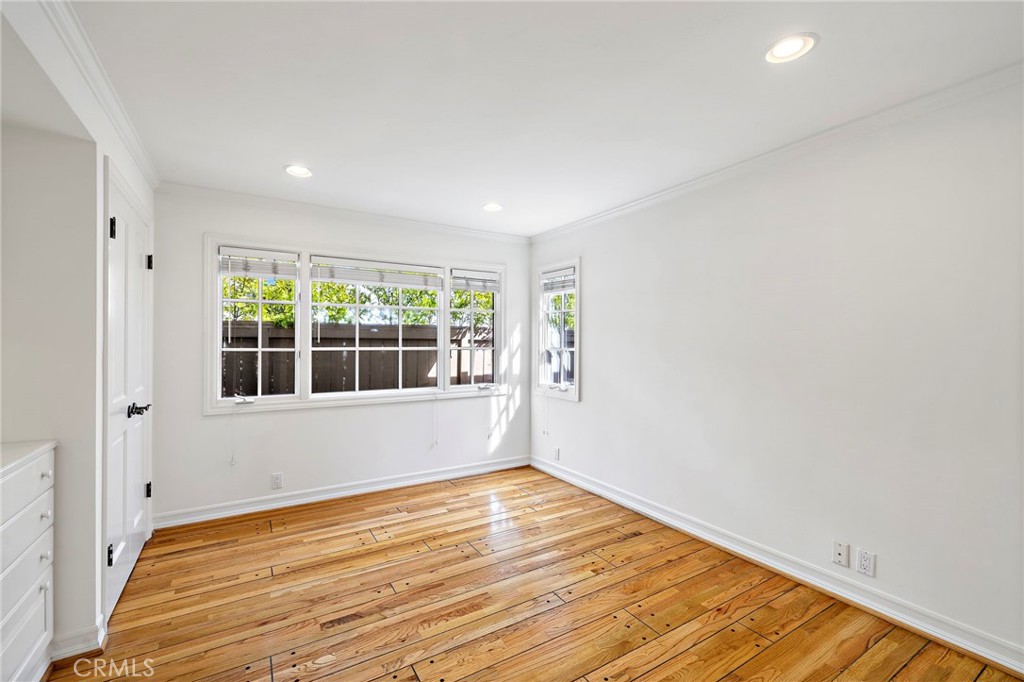 508 Seaview Street Laguna Beach, CA 92651 - Photo 10 of 28 a view of an empty room with wooden floor and a window