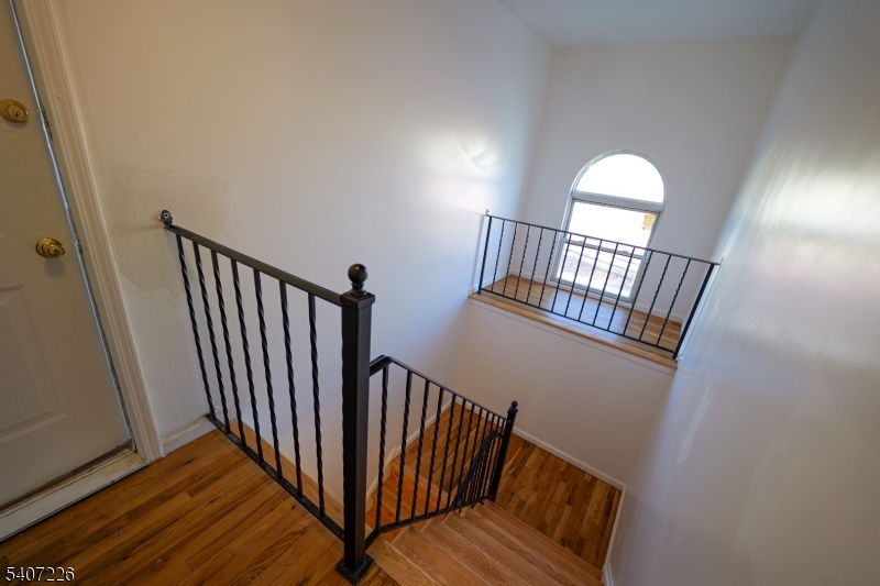 40 11th Avenue West, Unit 2 Newark, NJ 07107 - Photo 15 of 15 a view of staircase with wooden floor and fan