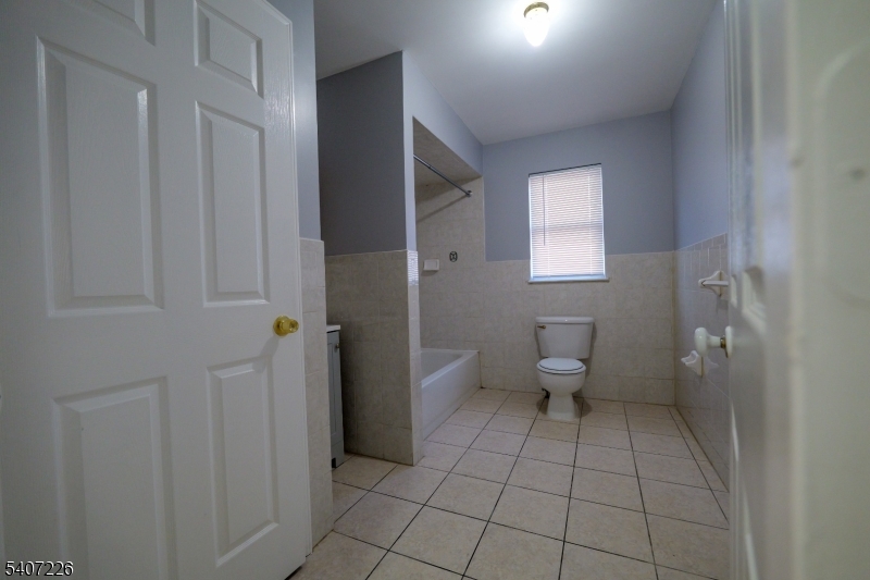 40 11th Avenue West, Unit 2 Newark, NJ 07107 - Photo 6 of 15 a bathroom with a toilet