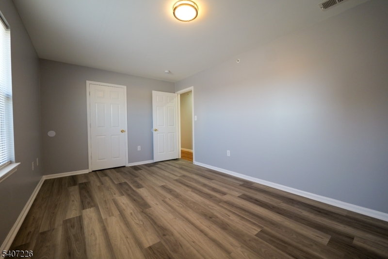 40 11th Avenue West, Unit 2 Newark, NJ 07107 - Photo 10 of 15 a view of an empty room and window