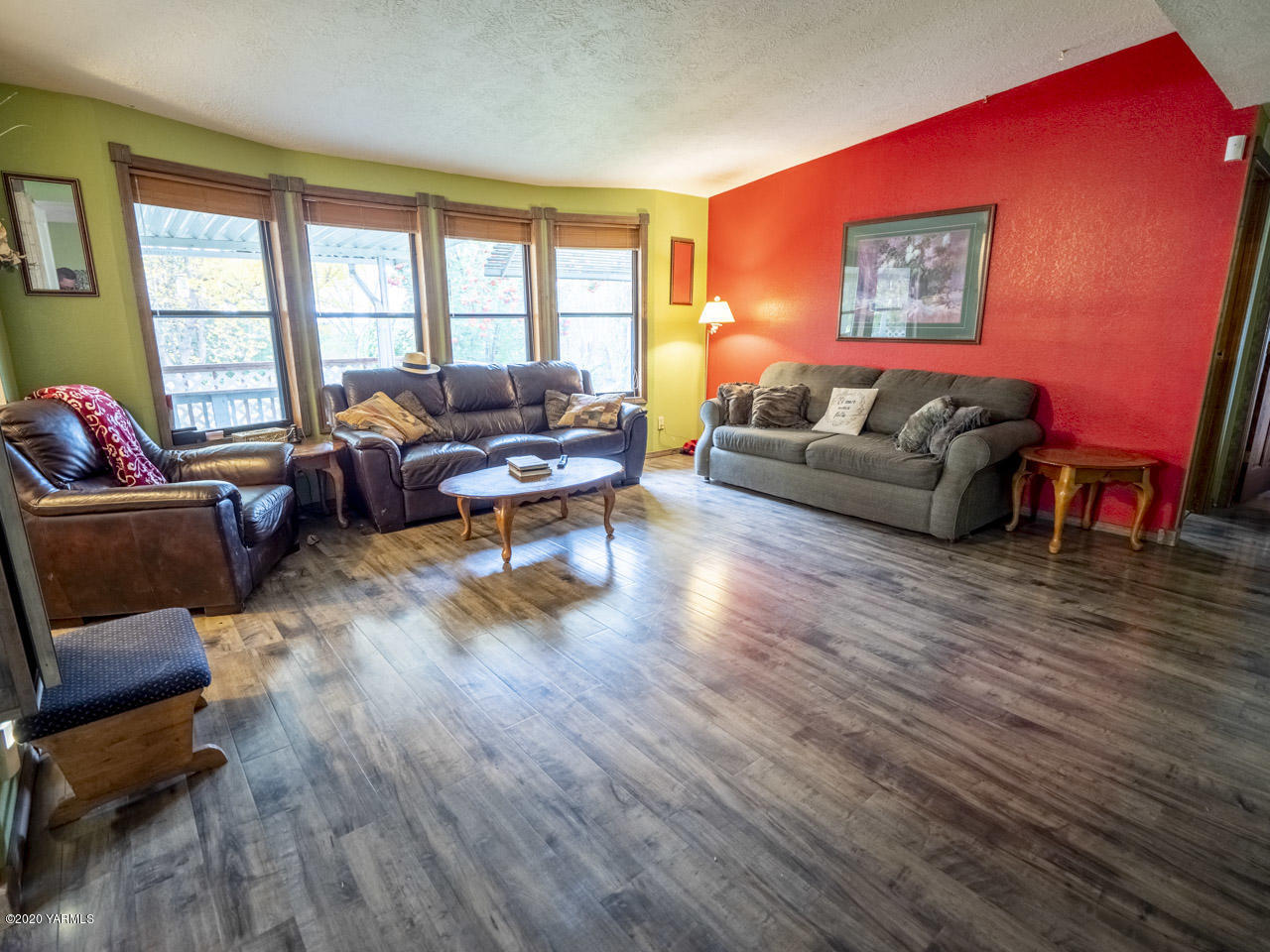 831 Swan Road Sunnyside, WA 98944 - Photo 3 of 19 a living room with furniture and a wooden floor
