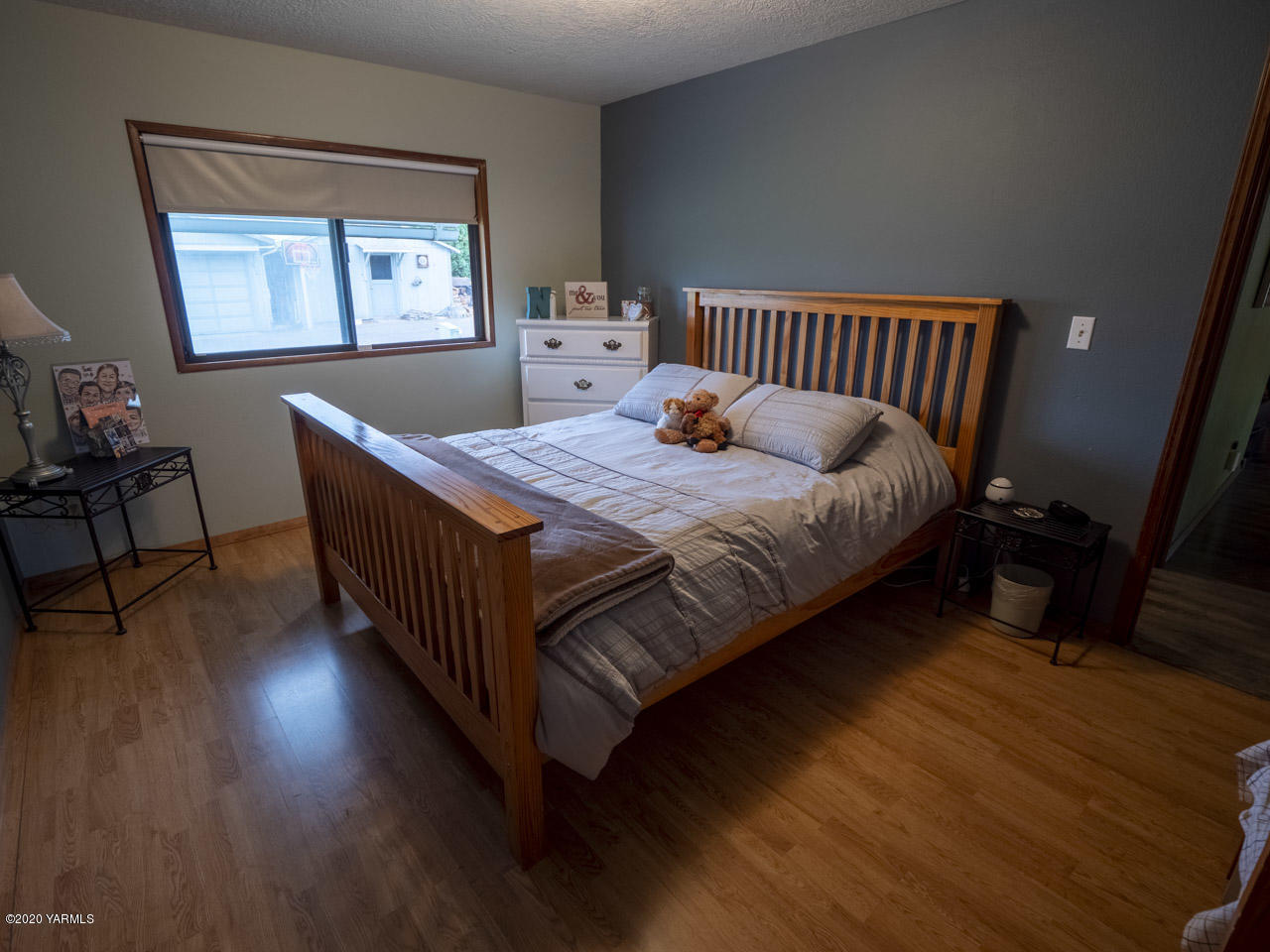 831 Swan Road Sunnyside, WA 98944 - Photo 6 of 19 a bed sitting in a bedroom next to a window
