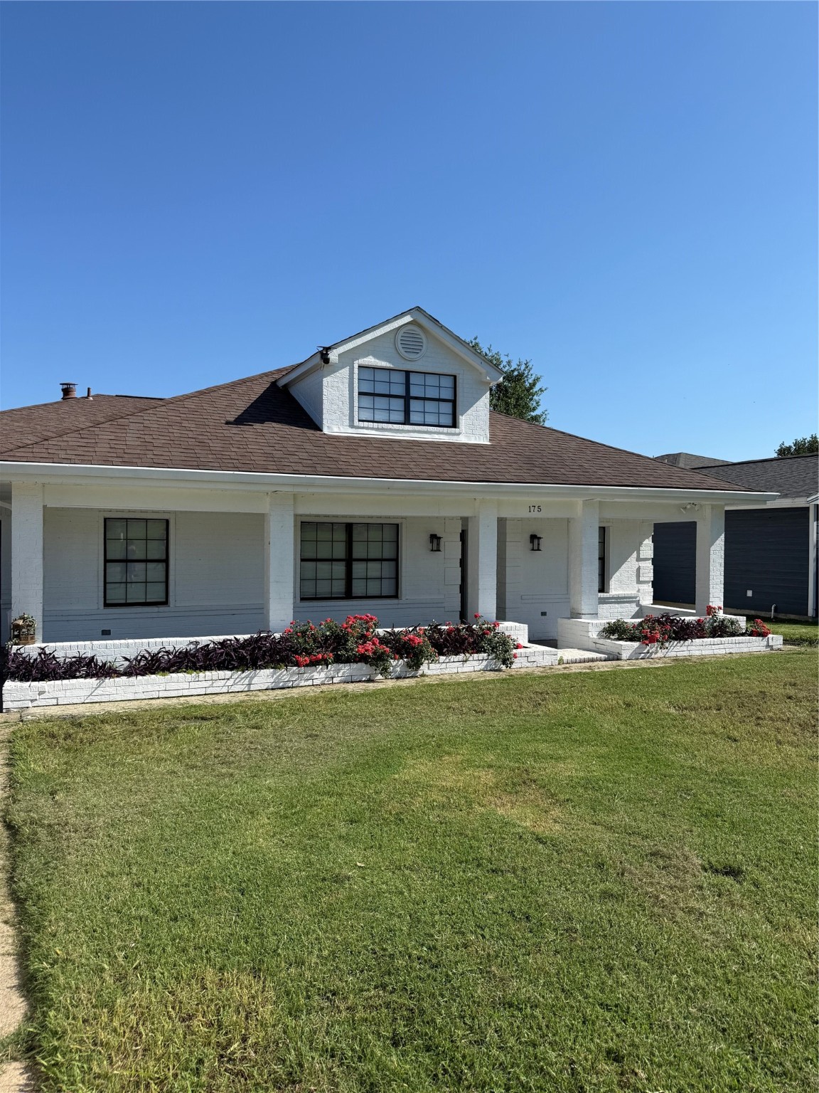 a view of a house with swimming pool and a yard