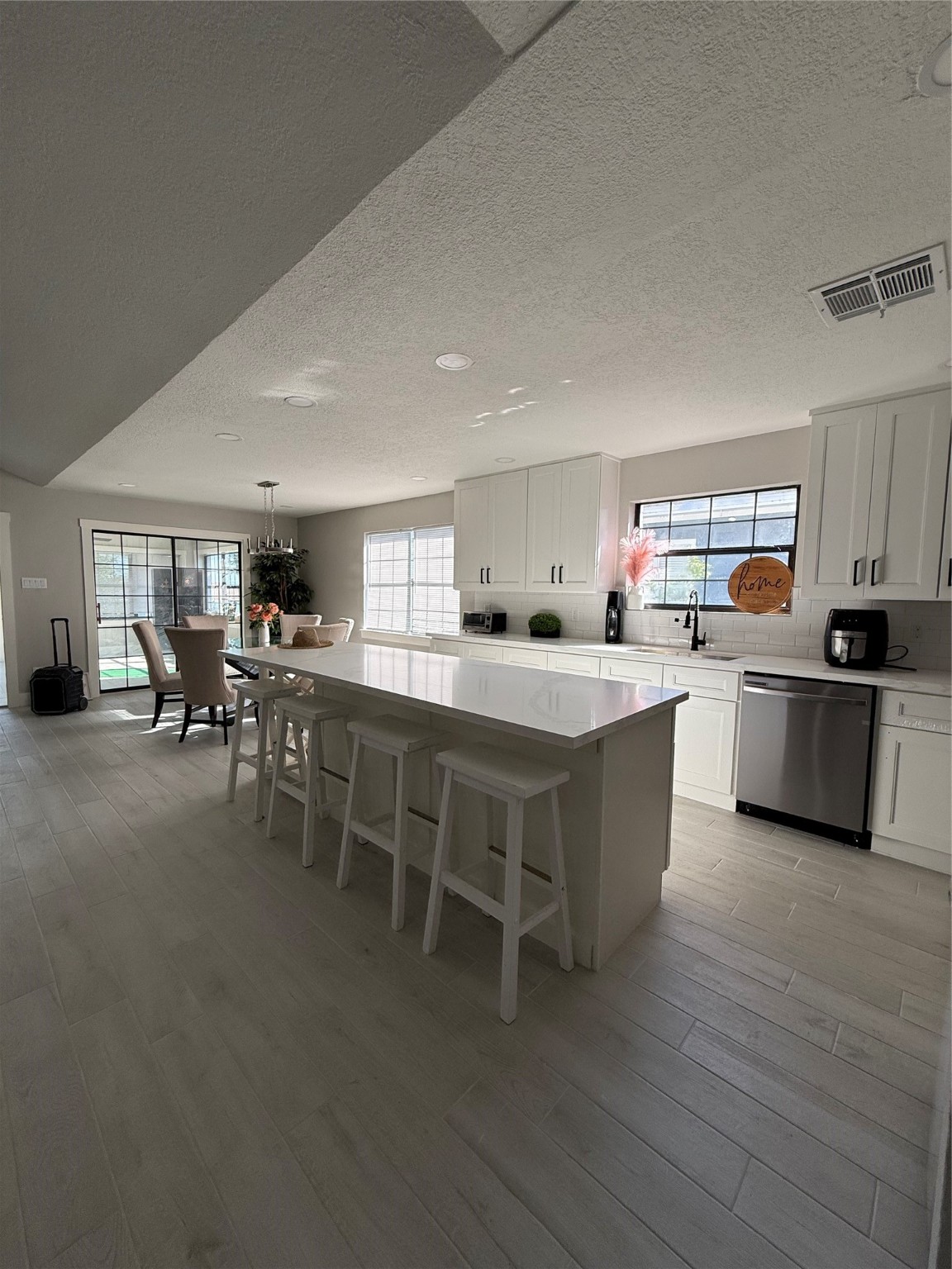 175 Heather Lane Livingston, TX 77351 - Photo 6 of 12 a kitchen with a sink and chairs