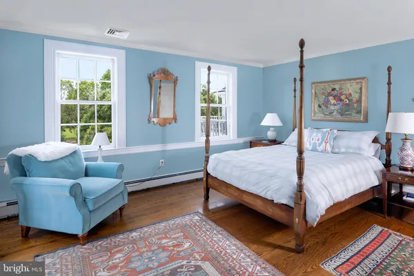 a bedroom with a bed and a couch
