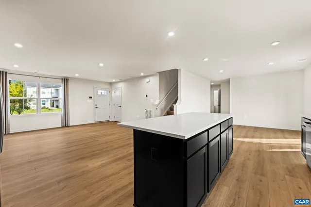a kitchen with stainless steel appliances a stove and a microwave