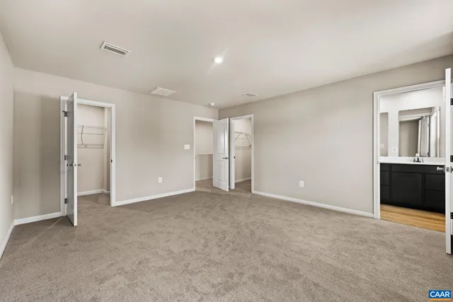 a view of an empty room with a cabinet