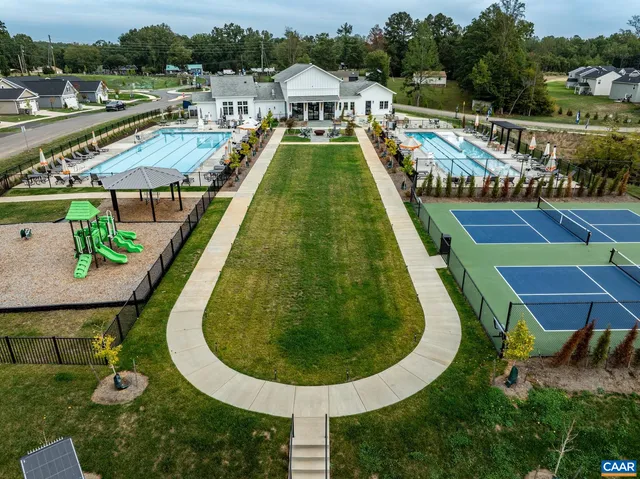 an aerial view of a house with a ocean view