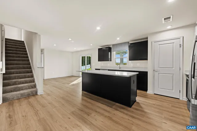 a view of a kitchen with a sink and a stove top oven