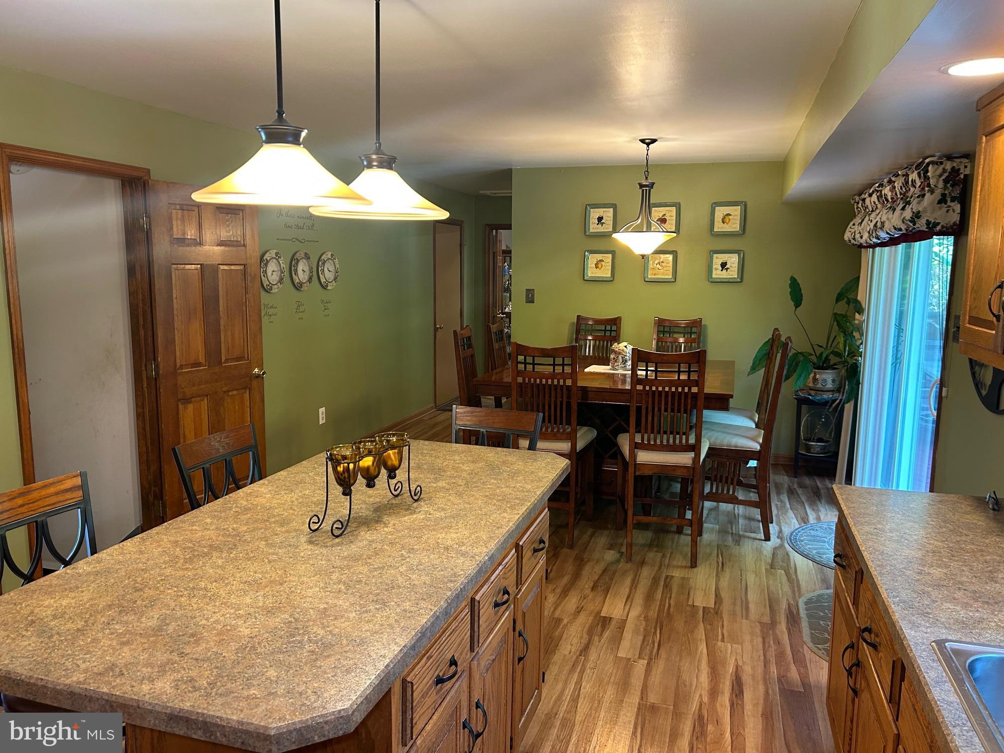 1008 Lincoln Avenue Springfield, PA 19064 - Photo 26 of 53 a dining room with a table chairs and a wooden floor