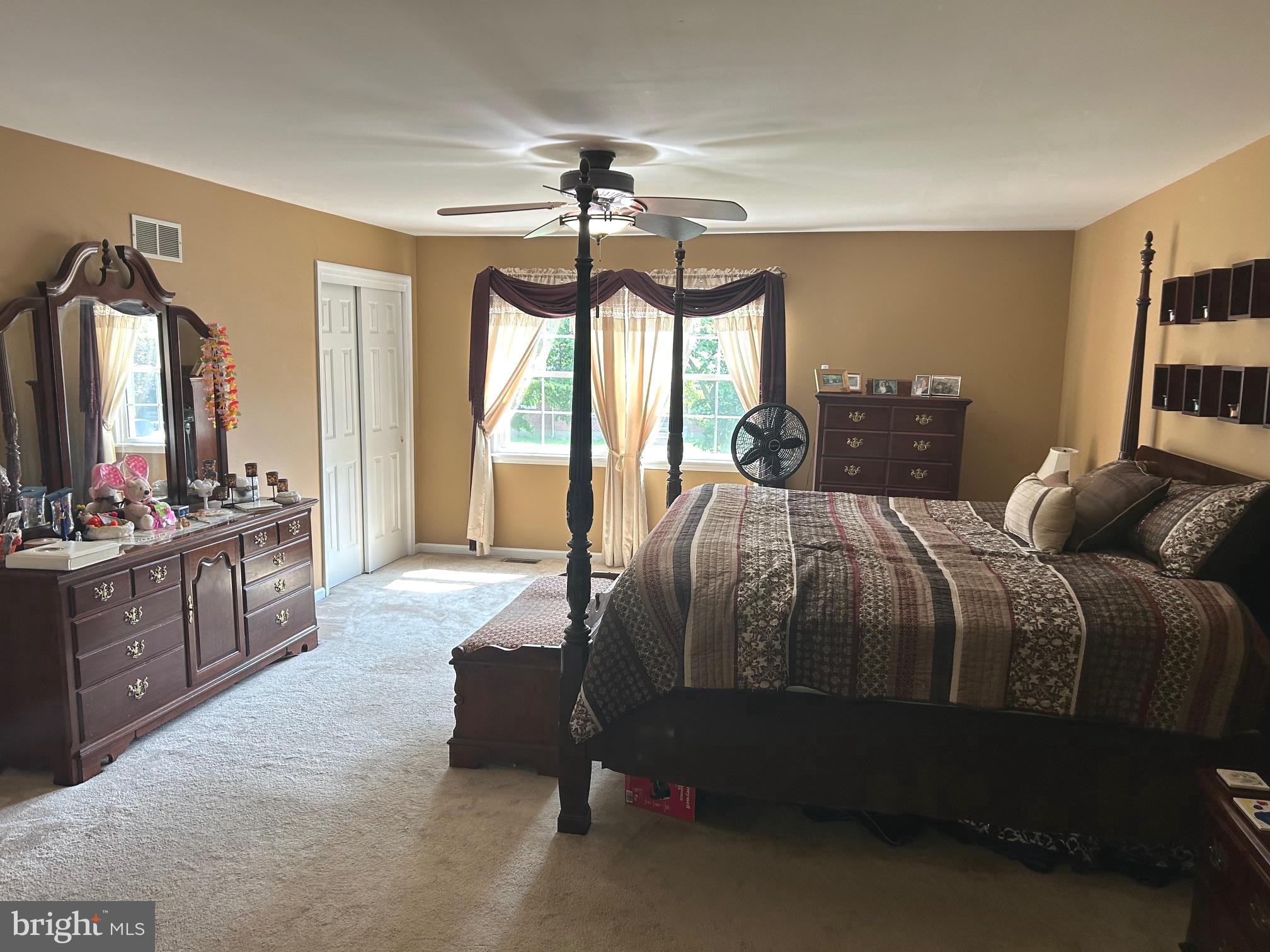 1008 Lincoln Avenue Springfield, PA 19064 - Photo 36 of 53 a bedroom with a bed a chandelier and a flat tv screen