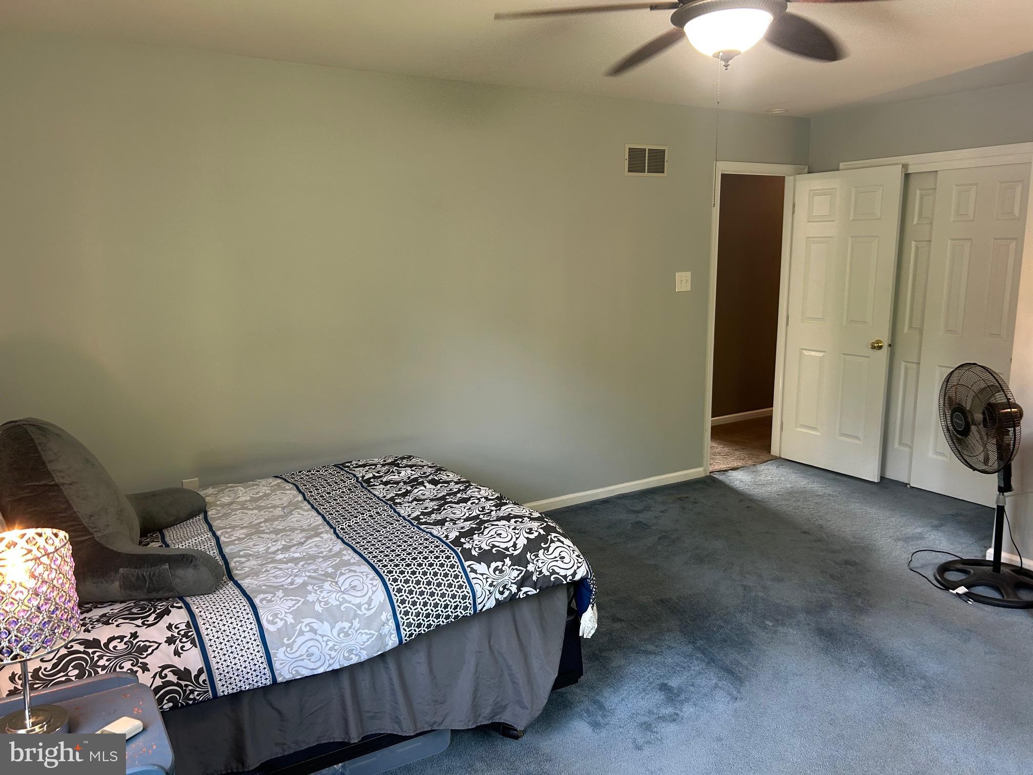 1008 Lincoln Avenue Springfield, PA 19064 - Photo 42 of 53 a bedroom with a bed and a chandelier