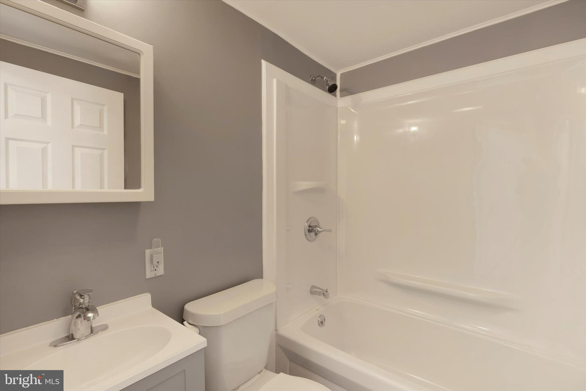 2 Windsor Acres Windsor, PA 17366 - Photo 13 of 18 a bathroom with a bathtub a sink a toilet and a mirror