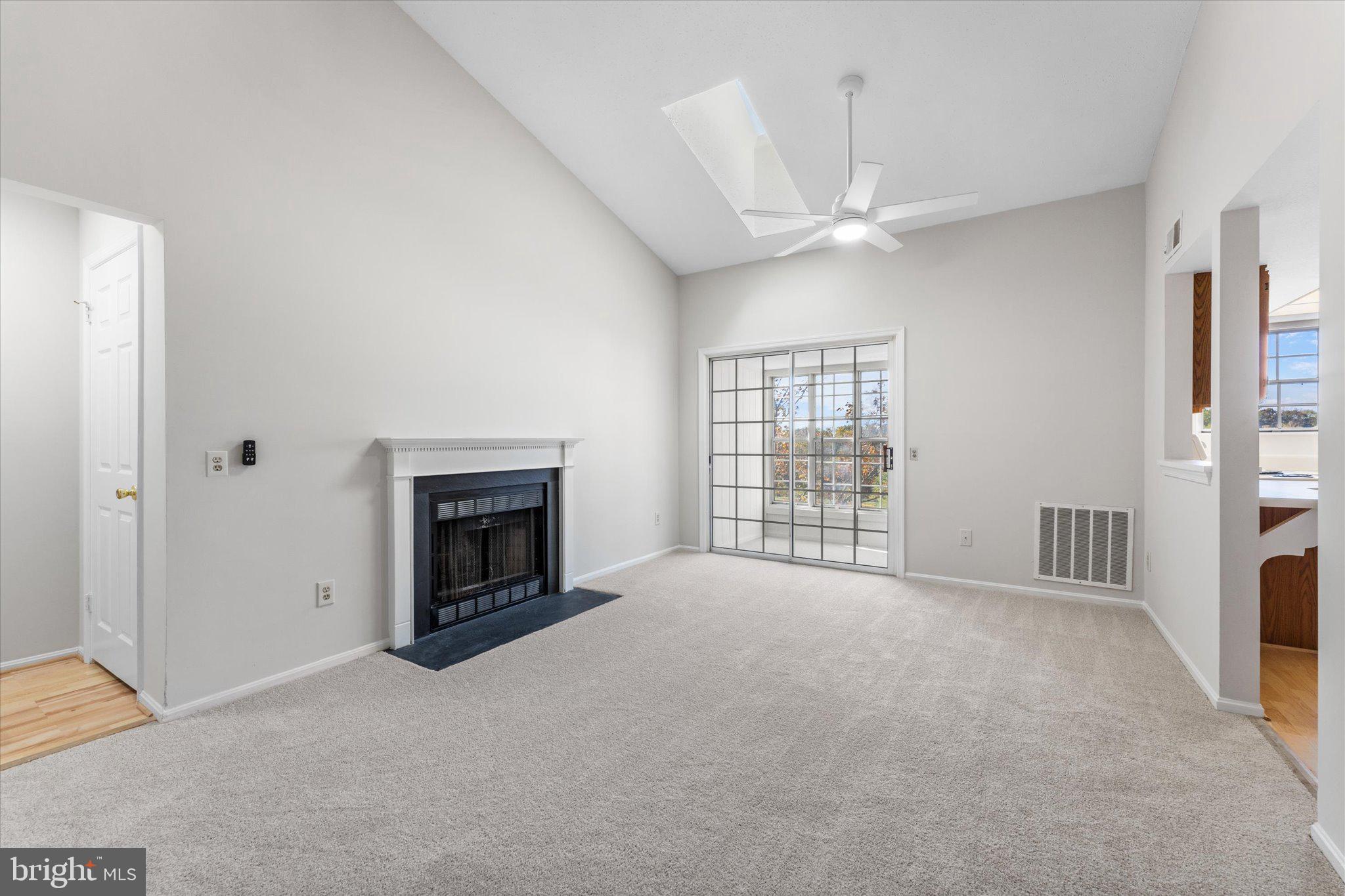 101 Fort Evans Road Southeast, Unit F Leesburg, VA 20175 - Photo 6 of 18 Vaulted ceilings and fireplace