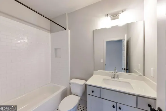 a kitchen with stainless steel appliances a refrigerator sink and microwave