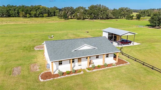 an aerial view of a house with a garden