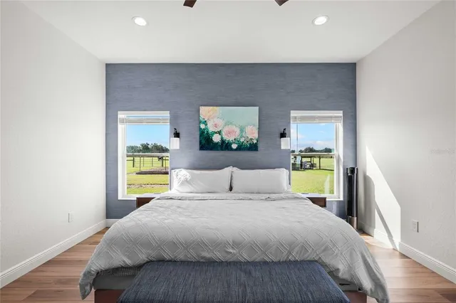 a bathroom with a double vanity sink and large mirror