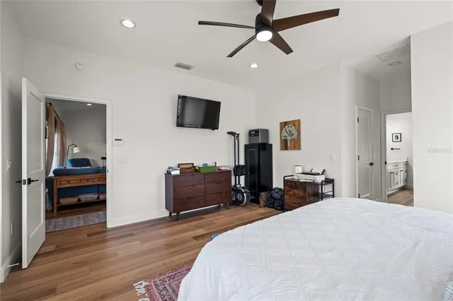a bathroom with double vanity sinks and two mirror