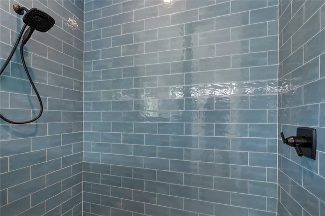 a bedroom with bed and a chandelier