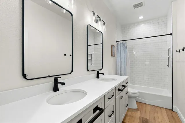 a bathroom with a shower and a toilet