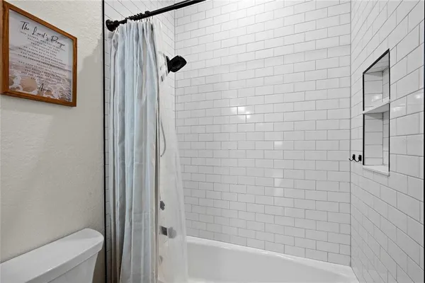 a kitchen with a stove and a microwave