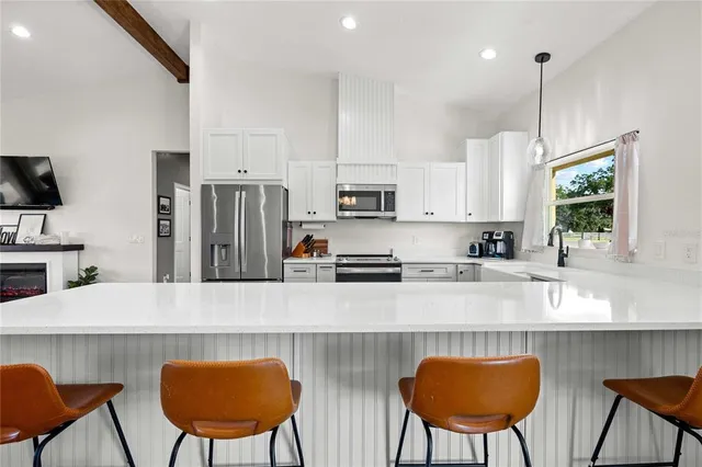 a kitchen with sink cabinets and window