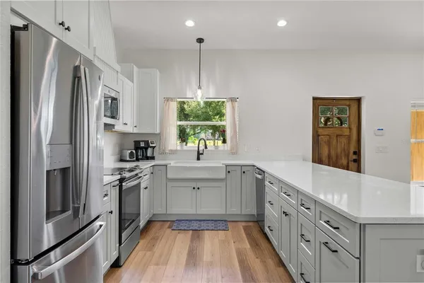 an aerial view of a residential houses with outdoor space