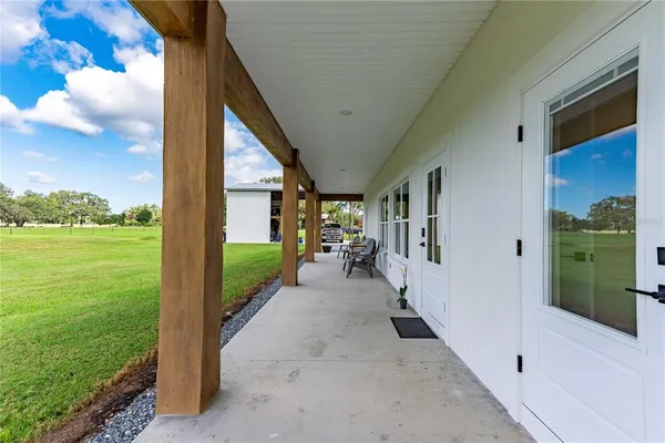 a view of a swimming pool with an ocean view and a mountain view