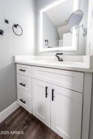 a bathroom with a sink and a mirror