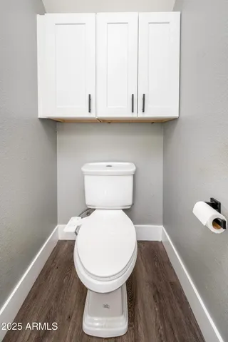 a bathroom with a toilet and a sink