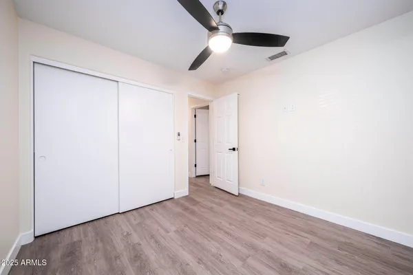 an empty room with wooden floor