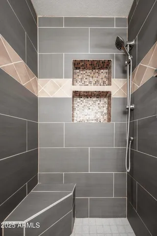 a bathroom with a shower and a sink