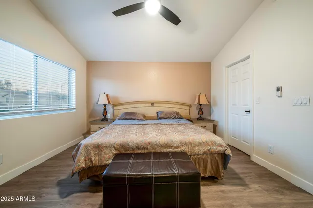 a bedroom with a bed and window