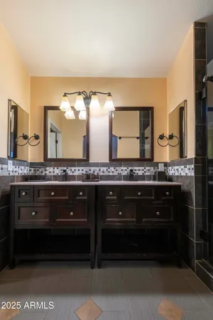 a bathroom with a sink and a large mirror