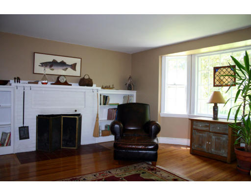 131 Concord Road Wayland, MA 01778 - Photo 3 of 14 a living room with furniture and a fireplace