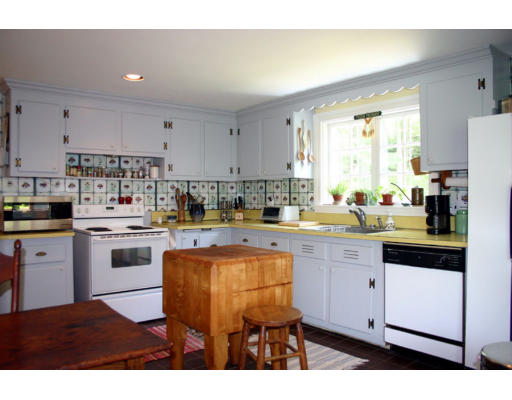 131 Concord Road Wayland, MA 01778 - Photo 4 of 14 a kitchen with stainless steel appliances granite countertop a sink a stove a refrigerator and cabinets