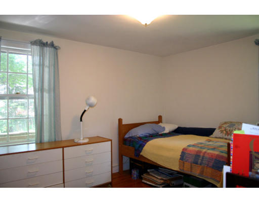 131 Concord Road Wayland, MA 01778 - Photo 10 of 14 a bedroom with a bed window and cabinet