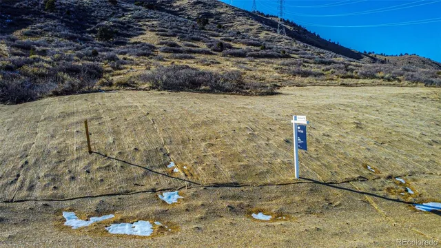 an aerial view of a houses with a yard
