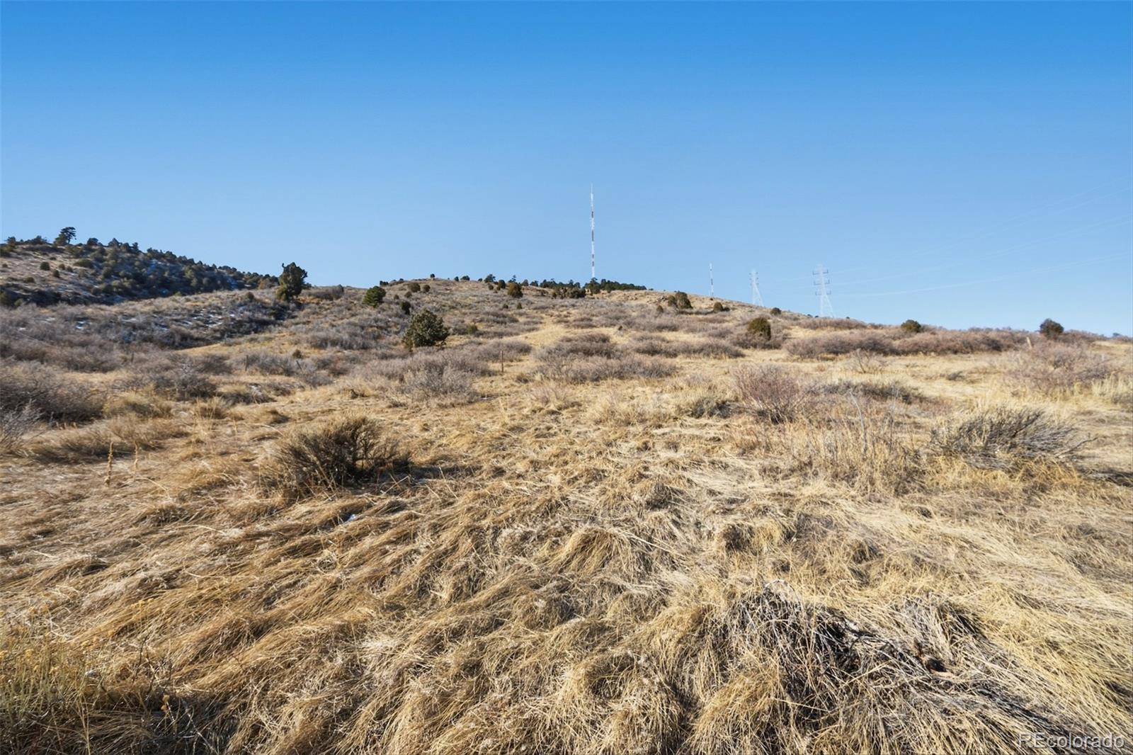 856 Shelton Road Golden, CO 80401 - Photo 4 of 17 a view of a large building with sky view
