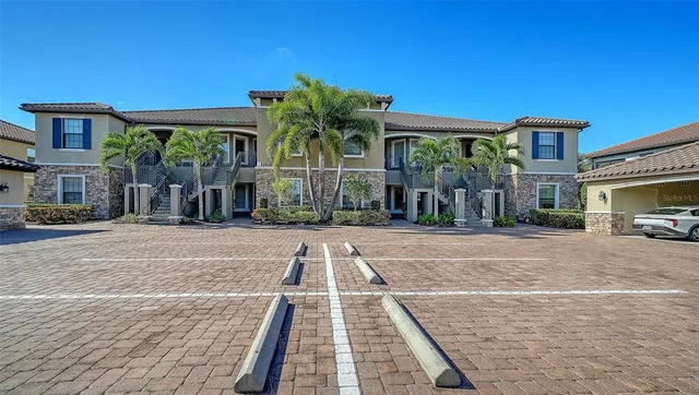 a view of a house with backyard porch and sitting area