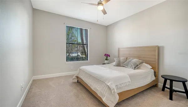 a living room with furniture and large window