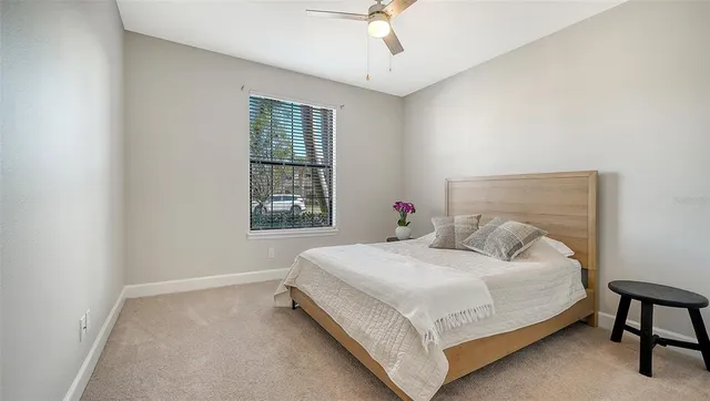 a living room with furniture and large window
