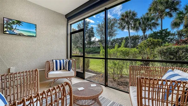 a living room with furniture fireplace and flat screen tv