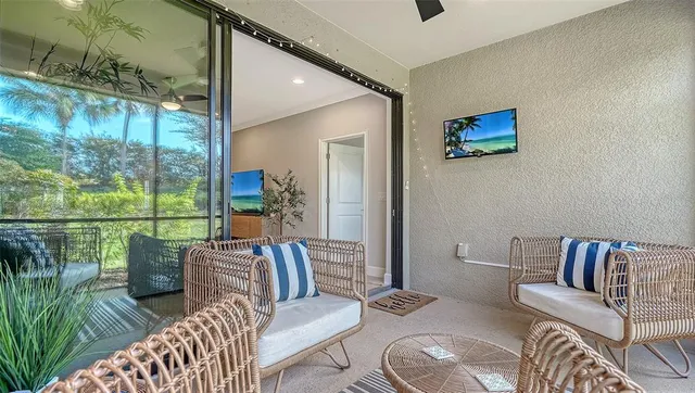 a very nice looking living room with a large window