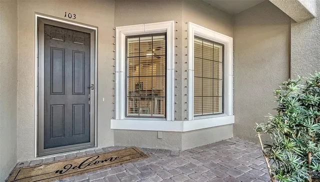 a kitchen with stainless steel appliances granite countertop a sink and a refrigerator